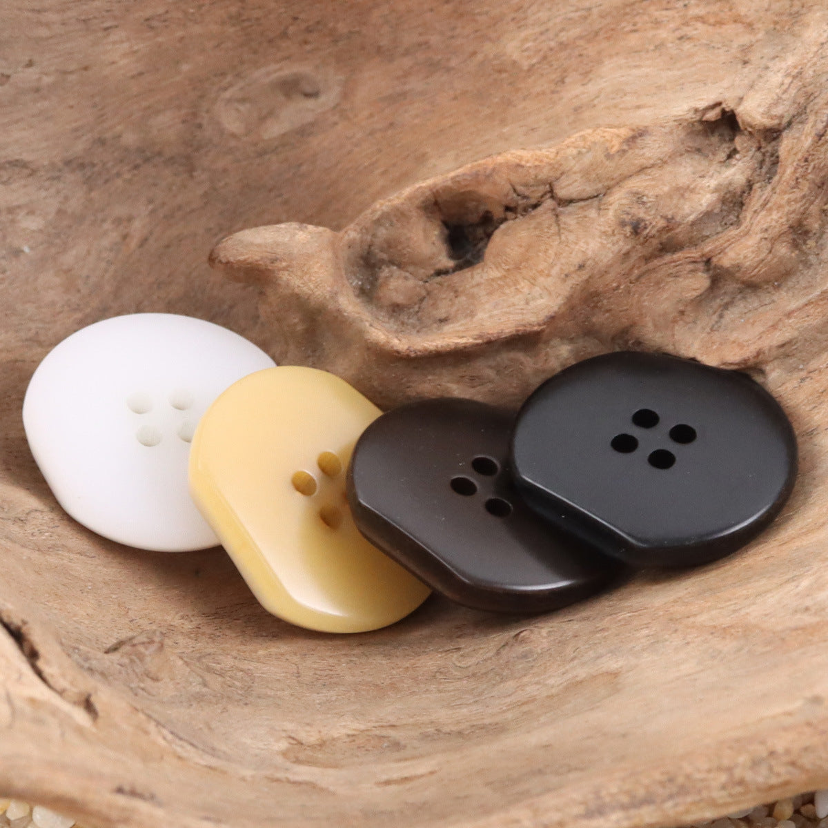 Four-hole resin buttons in white, light khaki, coffee brown and dark gray/black