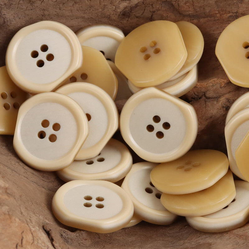 Khaki/yellow irregular four-hole resin buttons, multiple stacked close-up views