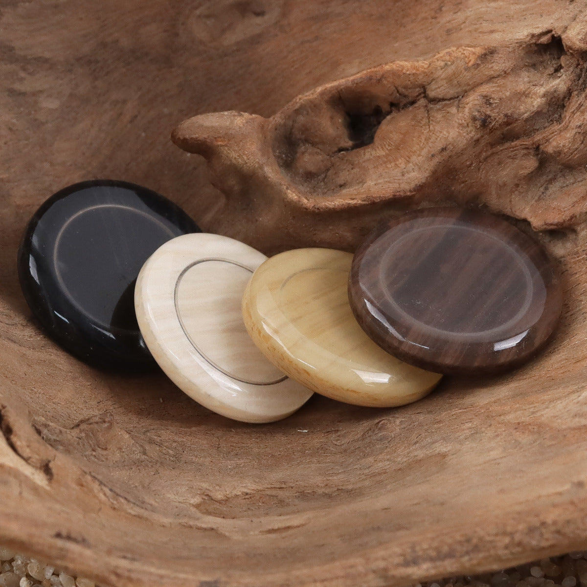 Round resin buttons with metal shanks in black, white, pale yellow, and wine-brown