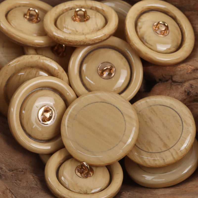 Pale yellow resin buttons with metal shanks, round sweater/cardigan style
