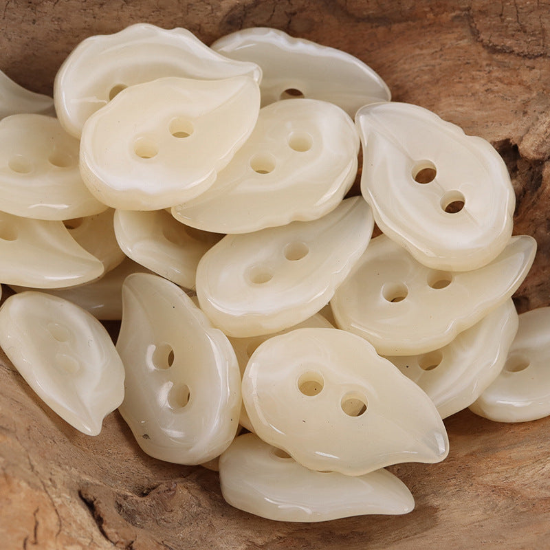 Beige leaf-shaped resin buttons, glossy, 2-hole design