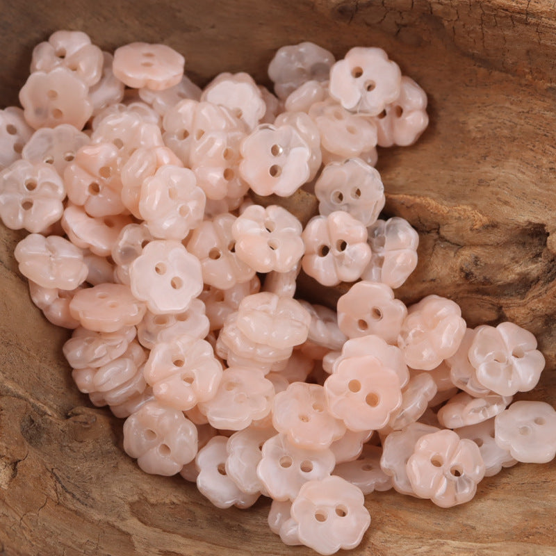 Light pink cherry blossom resin buttons with two holes, flower shape