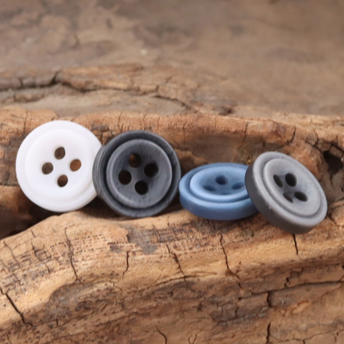 Round 11.5mm resin buttons, 4-hole, white, gray and blue gradient set on wood