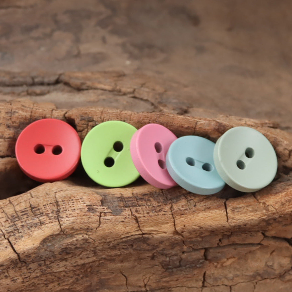Round 2-hole resin buttons: red, lime green, pink, light blue, white.
