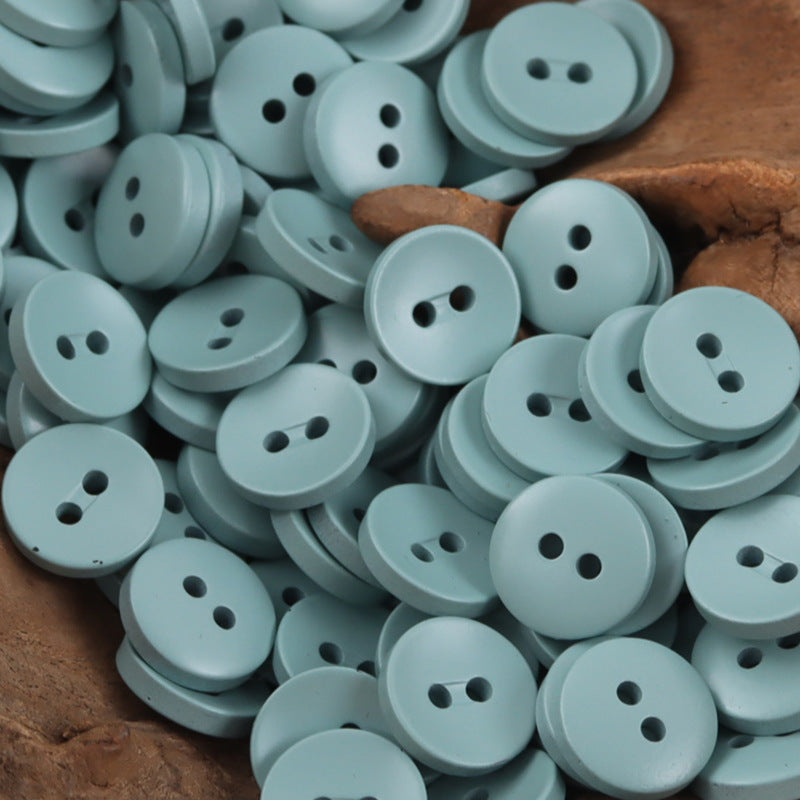 Light blue 2-hole resin buttons, round 11.5mm, craft pack.