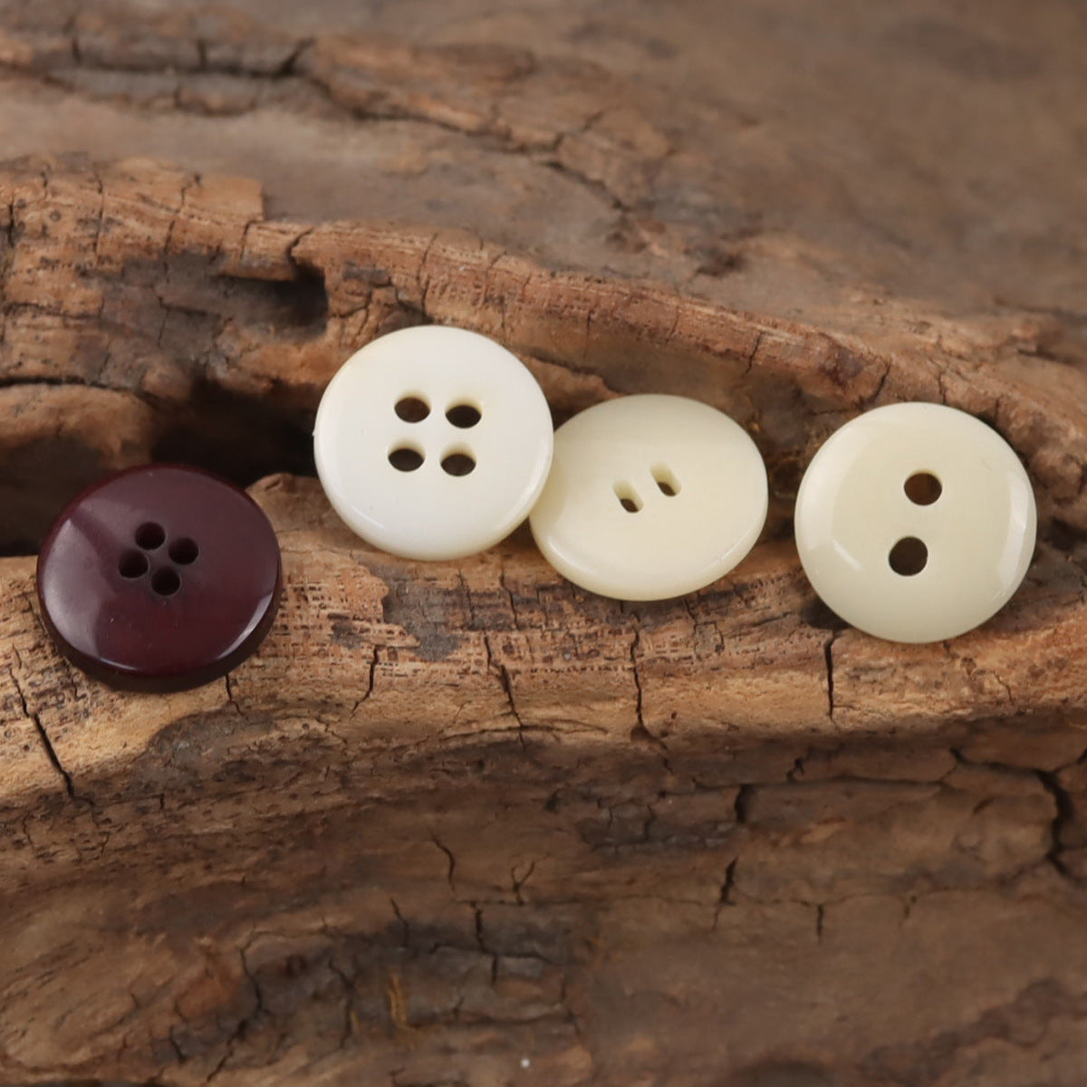 Beige and dark maroon round resin buttons with four-hole and two-hole designs