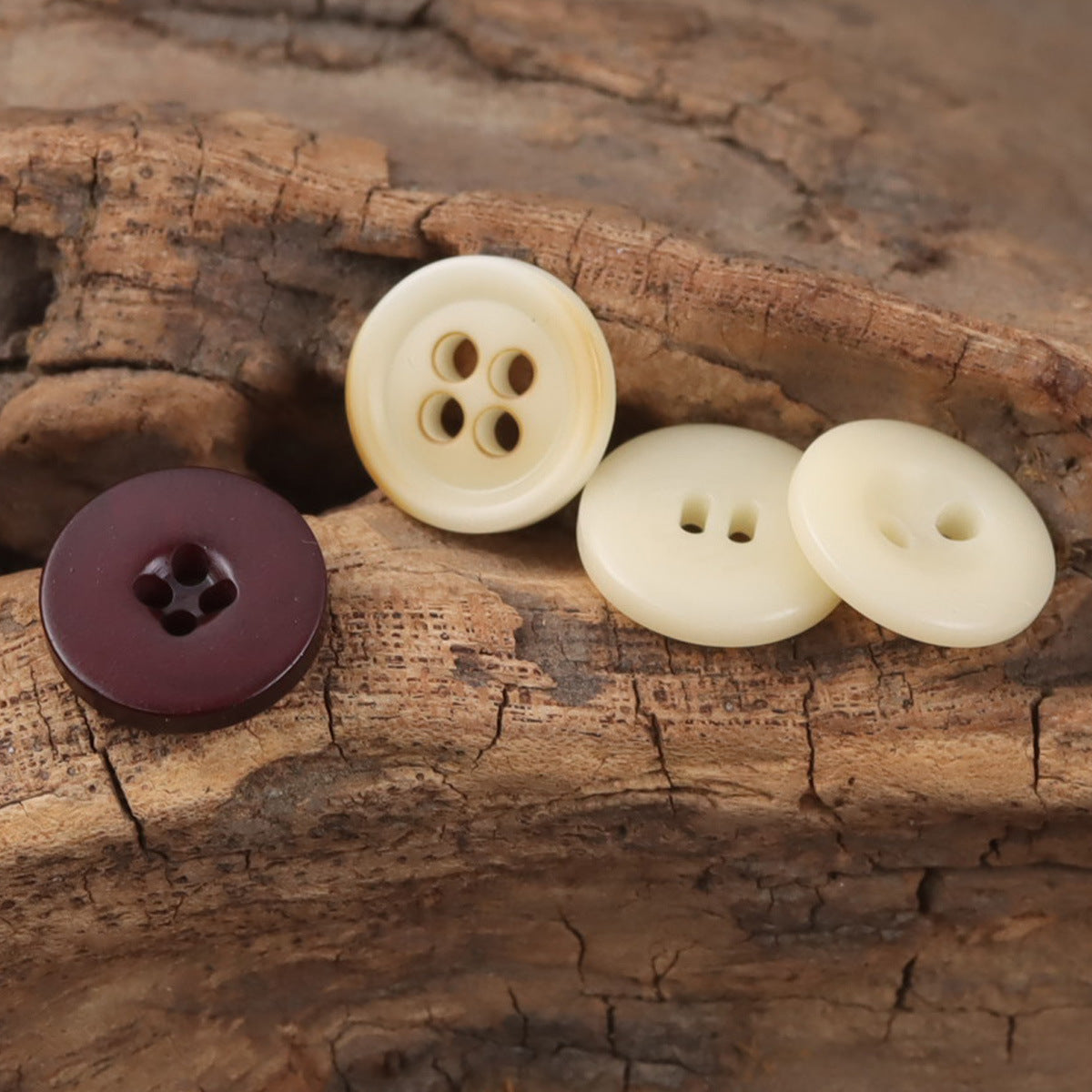 Round resin buttons in beige and dark maroon, mixed hole layouts