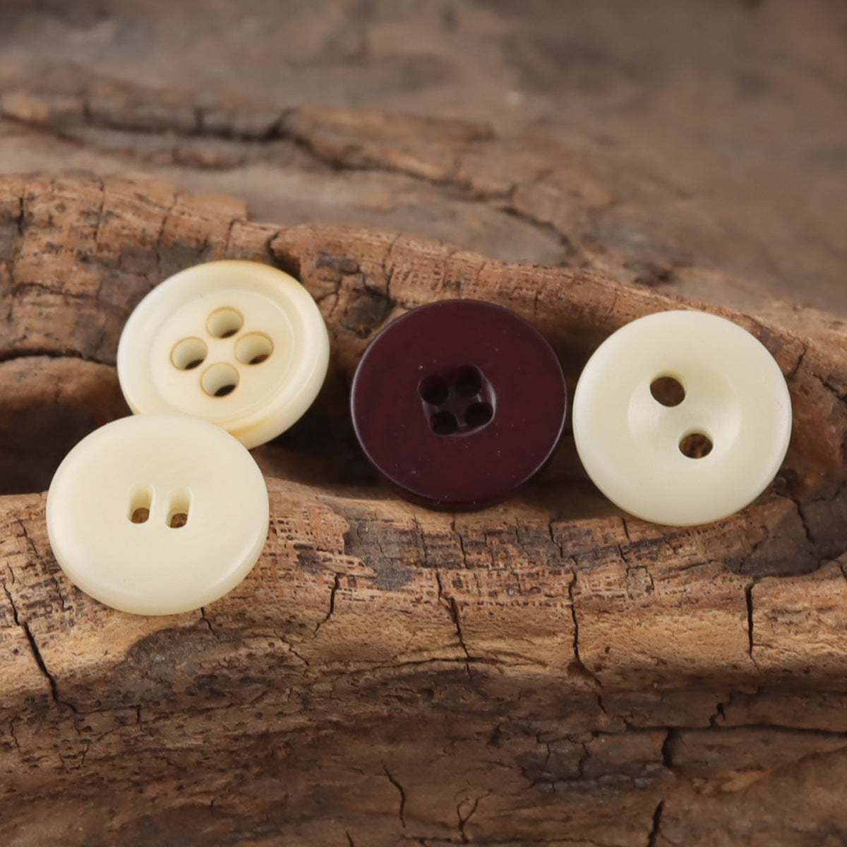 Assorted round resin buttons: beige and dark maroon, mixed hole shapes