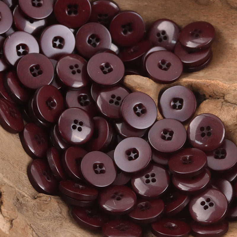 Dark maroon round resin buttons with mixed 4-hole and 2-hole designs