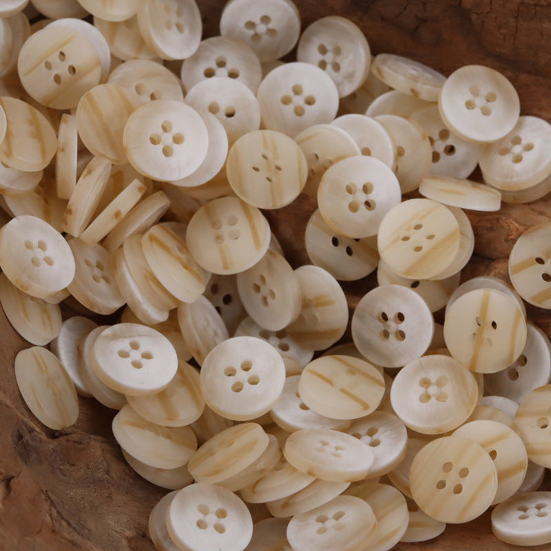 Round 4-hole resin buttons, light cream with subtle tan marbling, assorted set