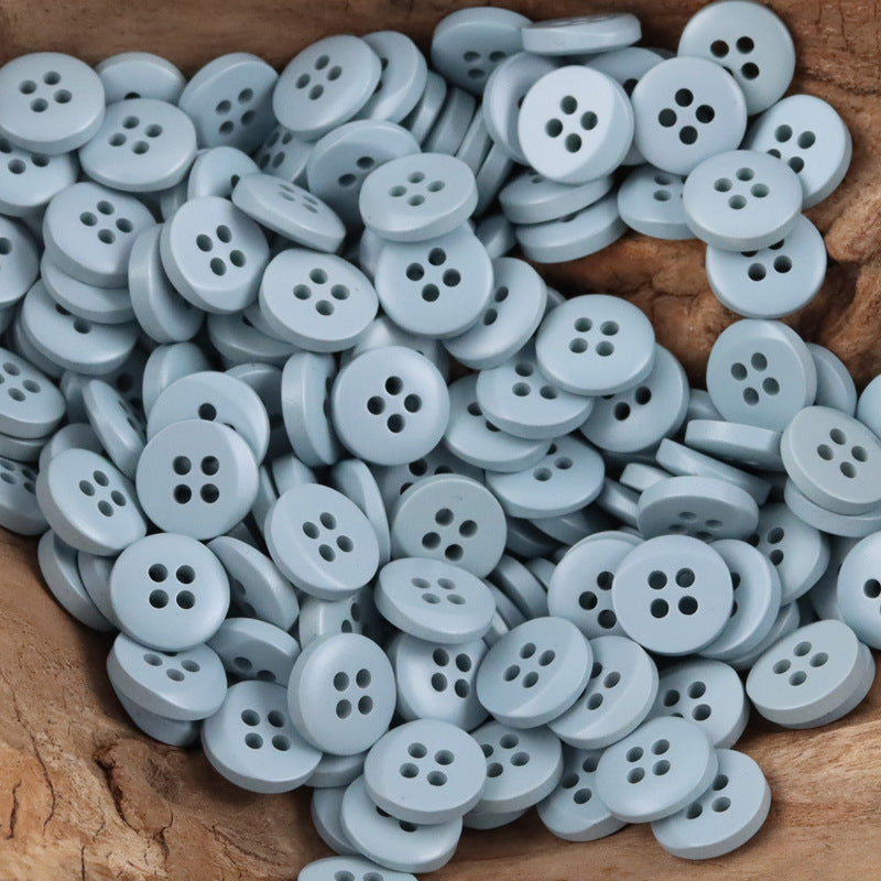 Resin buttons, semi-beveled, light blue, 4-hole—children’s dress sweater, 100 pack