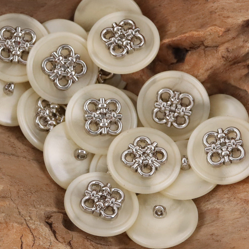 Ivory resin coat buttons with Chinese knot metal front details and metal shanks, group view