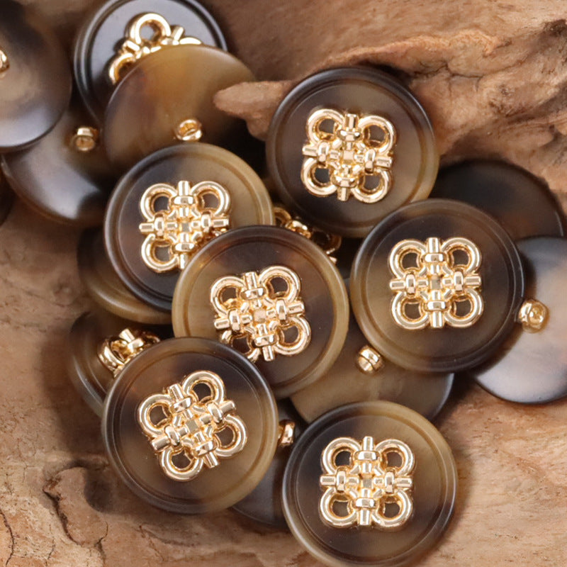 Dark brown/charcoal resin coat buttons with Chinese knot metal fronts and metal shanks, group