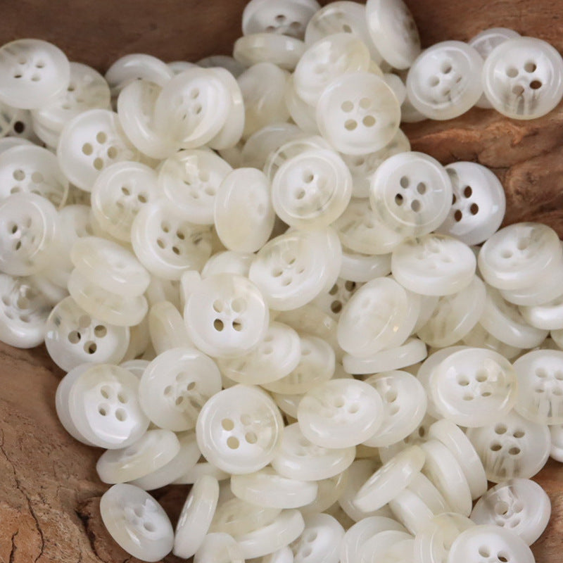 White round resin shirt buttons with four holes