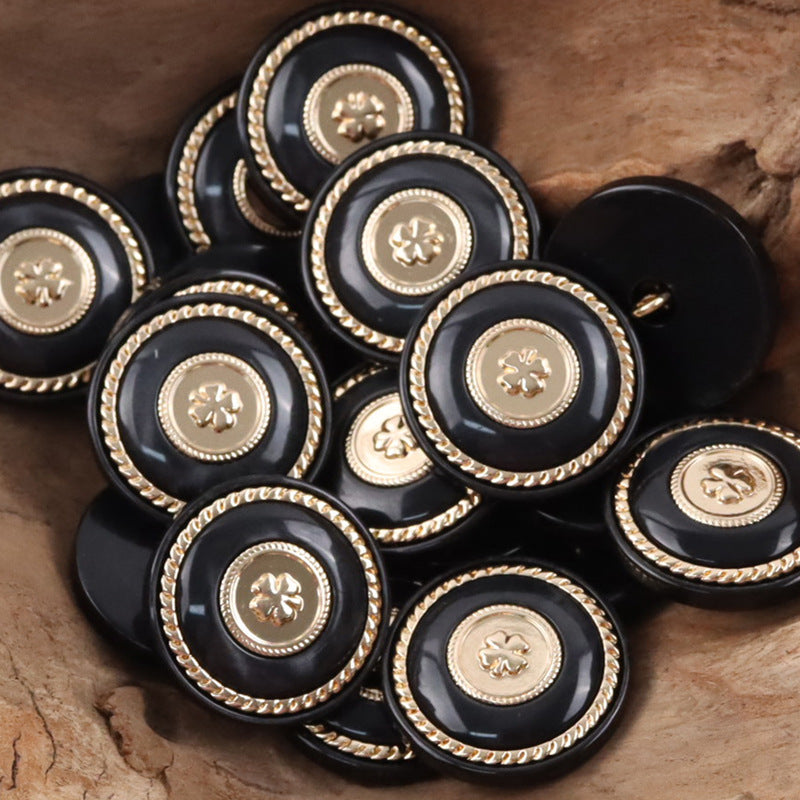 Black round resin buttons with gold clover centers and metal shanks, multiple pcs