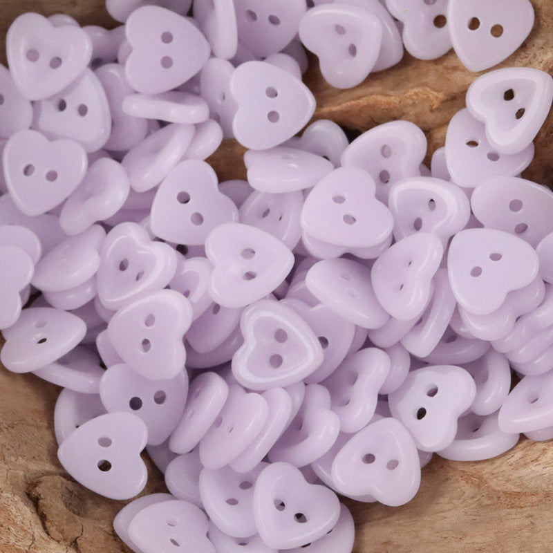 Ceramic heart buttons—light lavender style with two holes, mixed pile.
