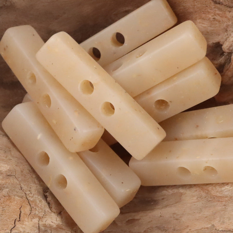 Two-hole long resin buttons, wood chip pattern, off-white translucent set