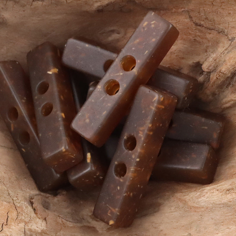 Two-hole long resin buttons, wood chip pattern, dark brown translucent variety