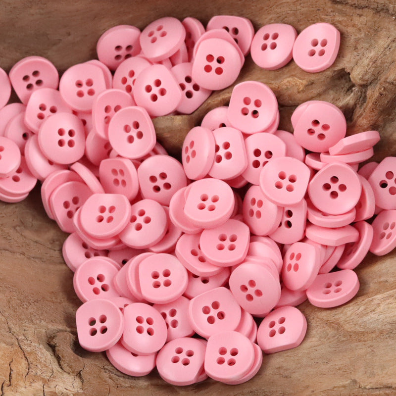 Pink resin buttons, round with four-hole centers, assorted bulk pieces for DIY