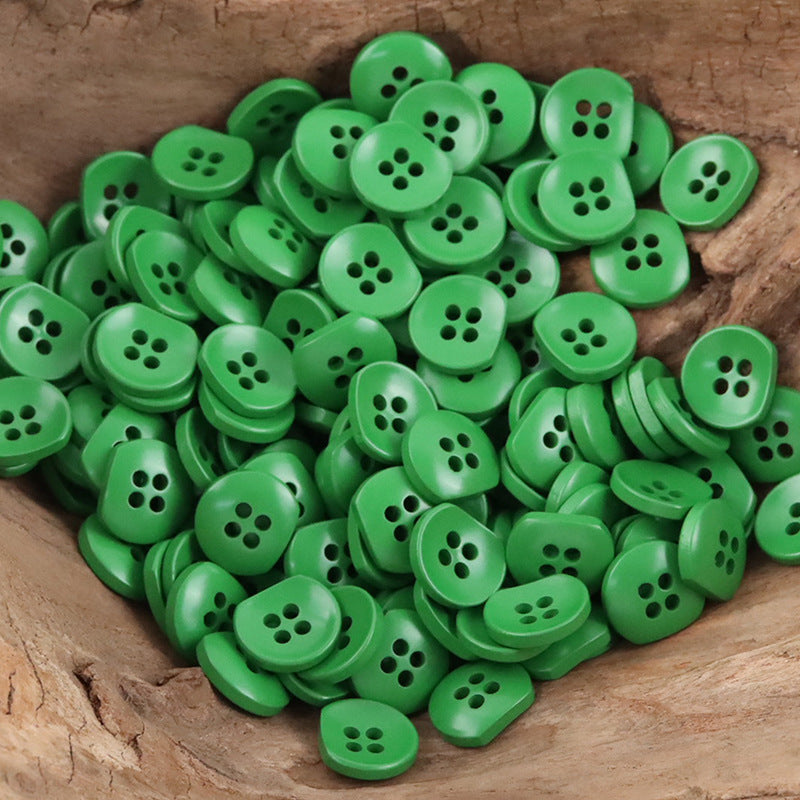 Bulk bright green semi-circular resin buttons with four holes