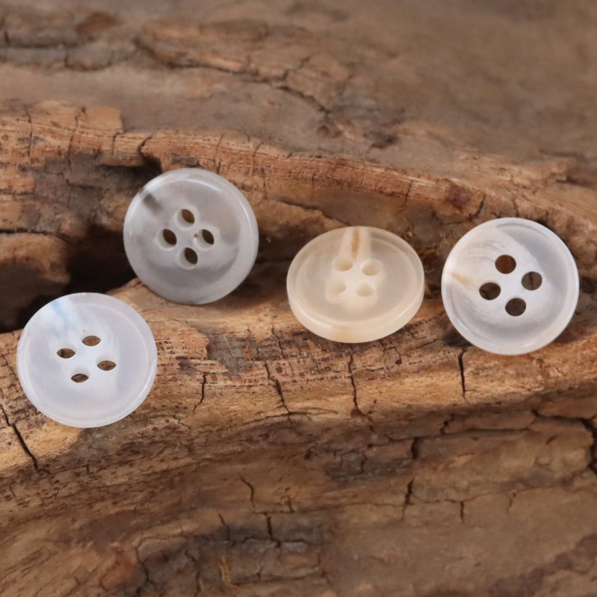 Semi-transparent resin shirt buttons, light gray, four-hole design