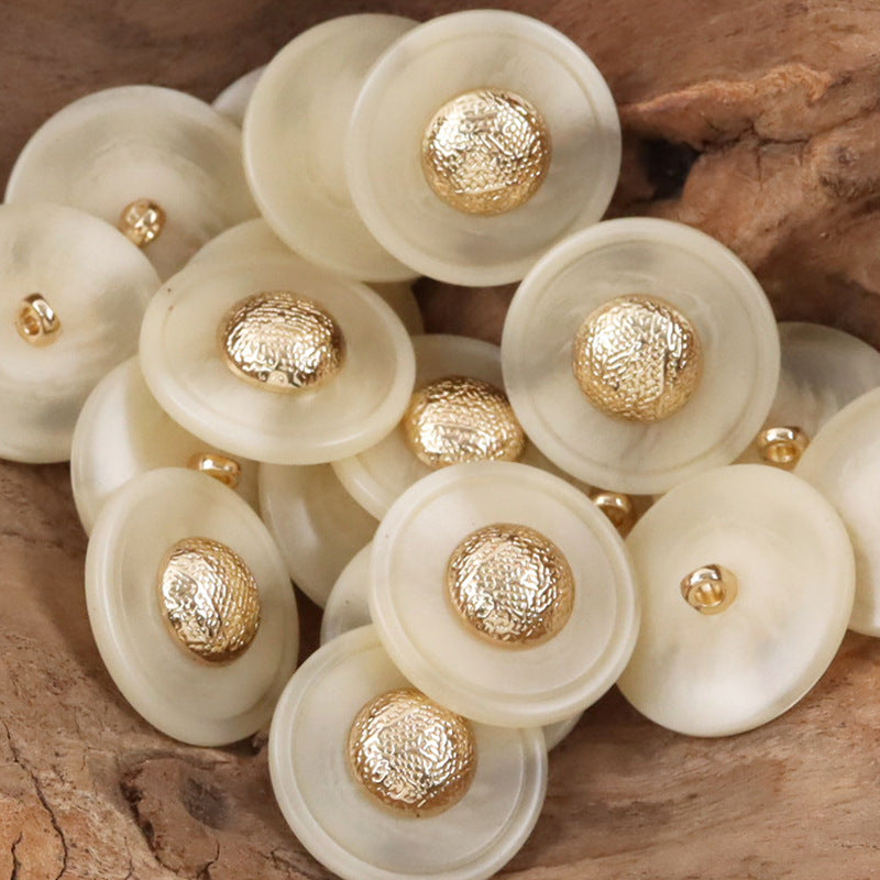 Set of cream resin buttons with textured gold-tone caps and metal shanks