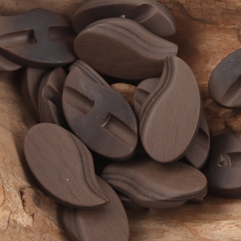 Coffee-brown comma-shaped matte resin shank buttons with slit shank holes