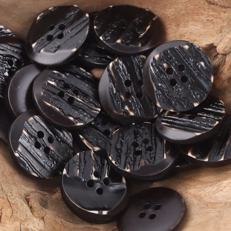 Black resin buttons with woodgrain stripes, 4-hole centers, beveled edges