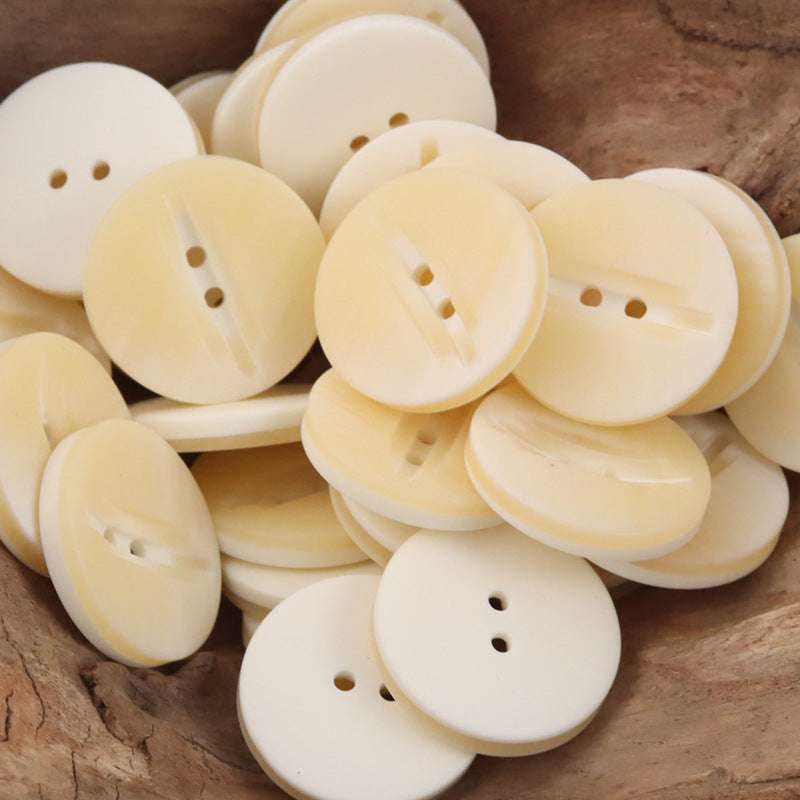 Cream 2-hole resin buttons, wood-grain finish, multiple pieces