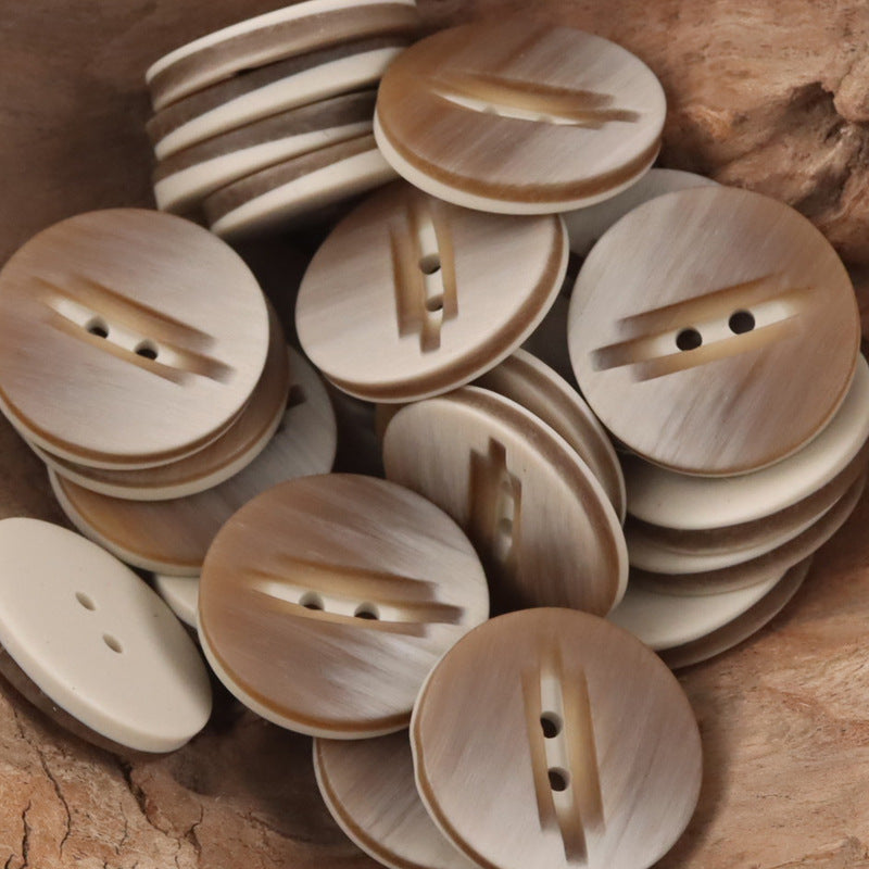 Assorted beige and brown 2-hole resin buttons with wood-grain stripes