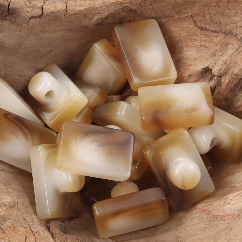 Rectangular resin buttons with shanks, mixed light to dark brown tones (assorted)