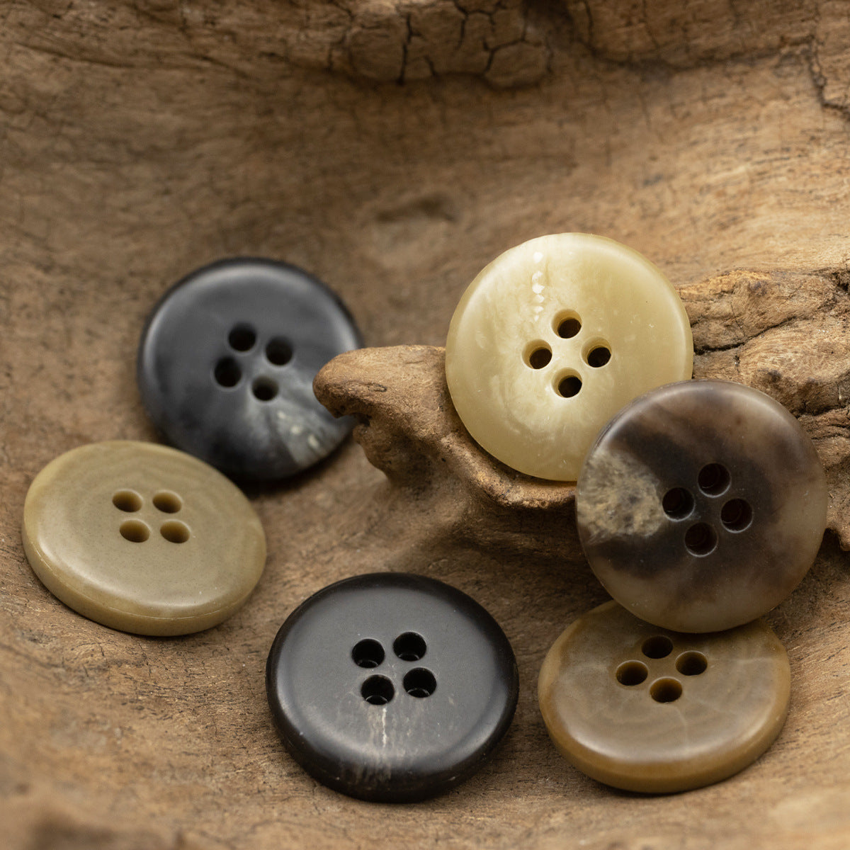 4-hole coat buttons mix: dark, tan, and cream urea finishes