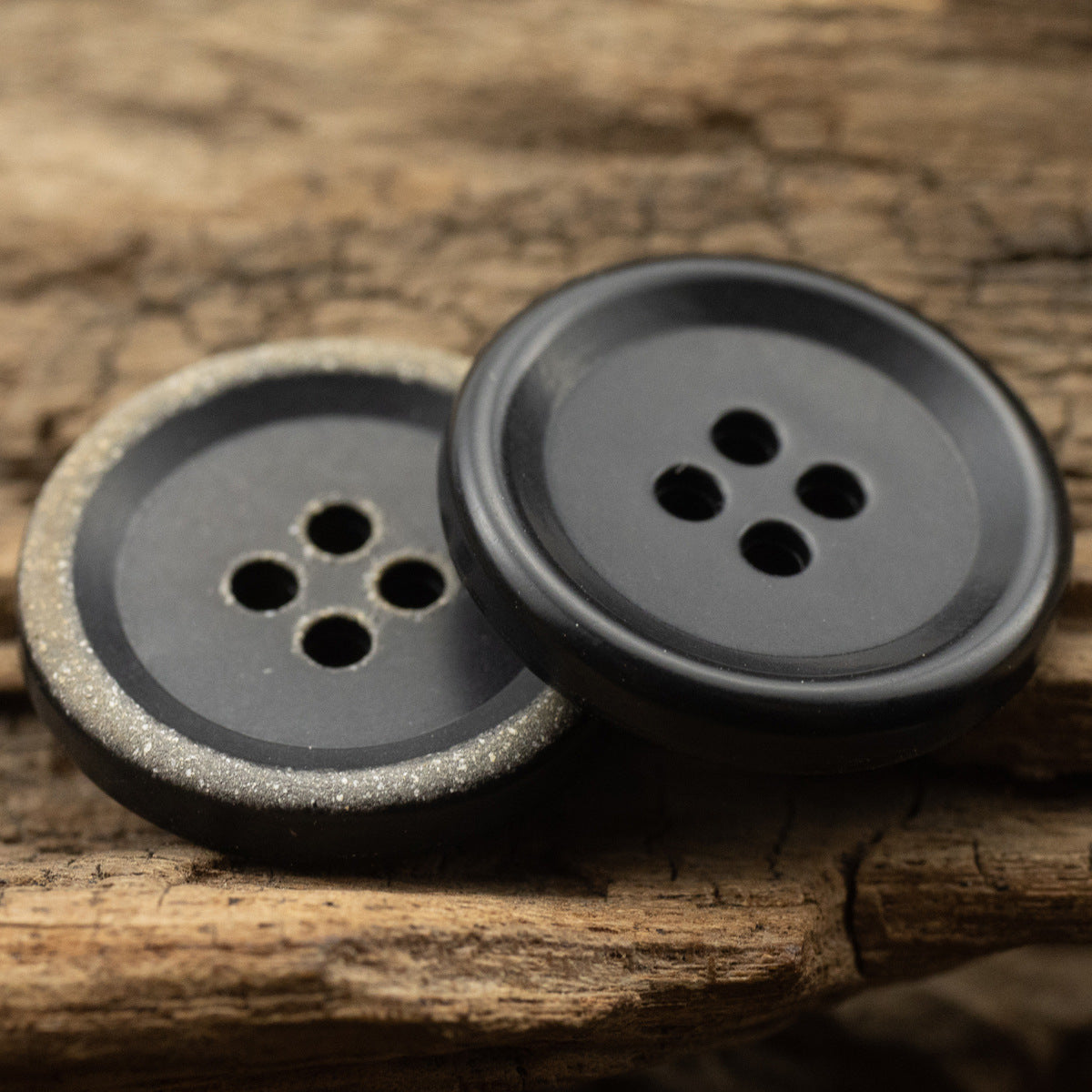 Urea jacket buttons, 4-hole, burnt-black finish with speckled rim