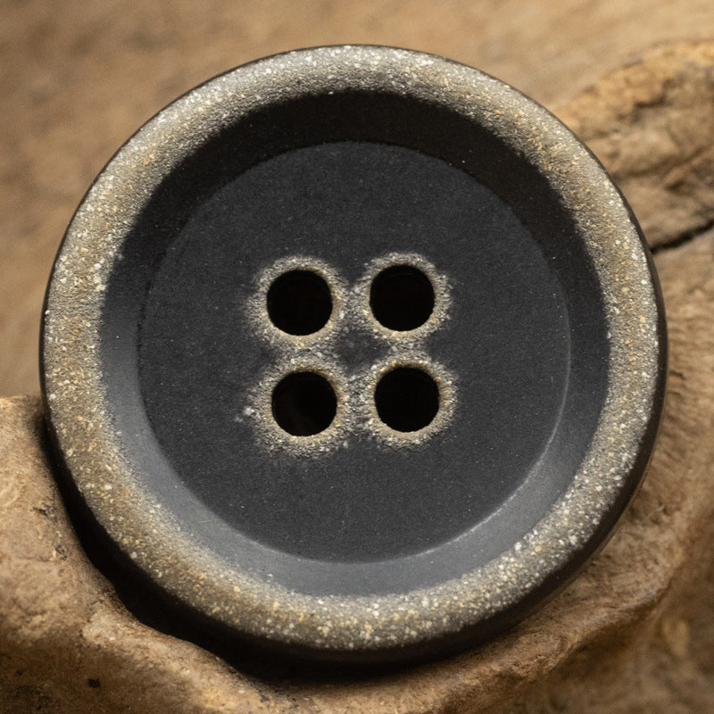 Burnt black urea button, 4-hole, metallic-speckled edge, 15–20mm