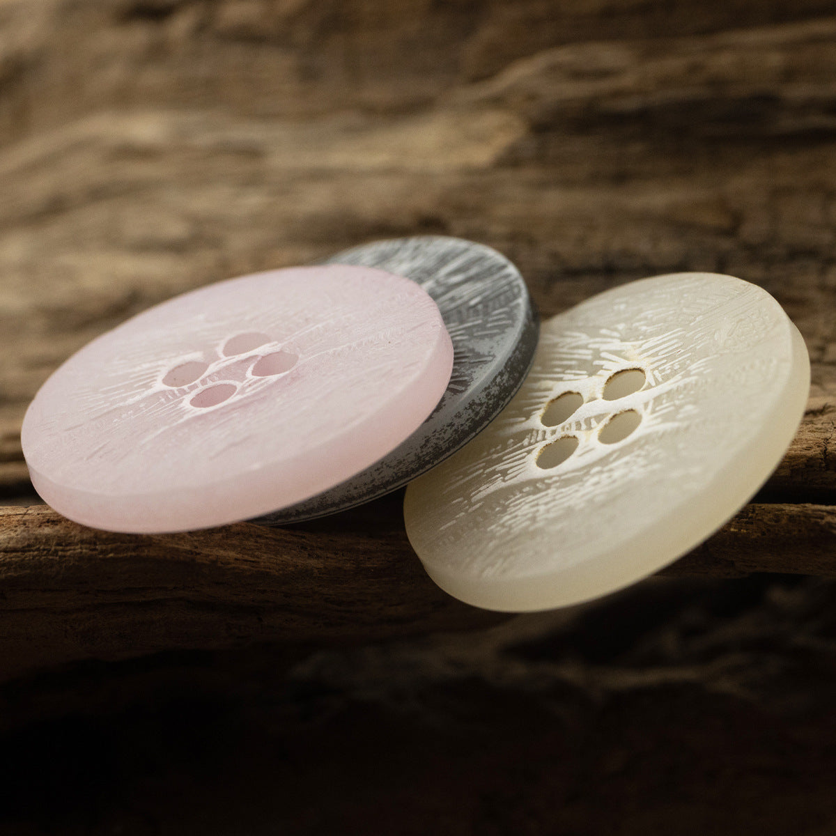 Pink, dark grey and cream imitation bark buttons with four-hole design