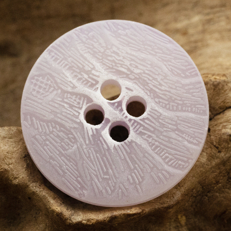 Lavender imitation bark button with four holes and distressed texture