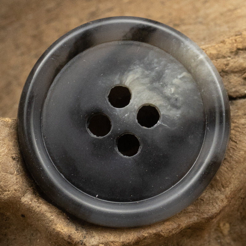 Round 4-hole button in dark gray urea resin