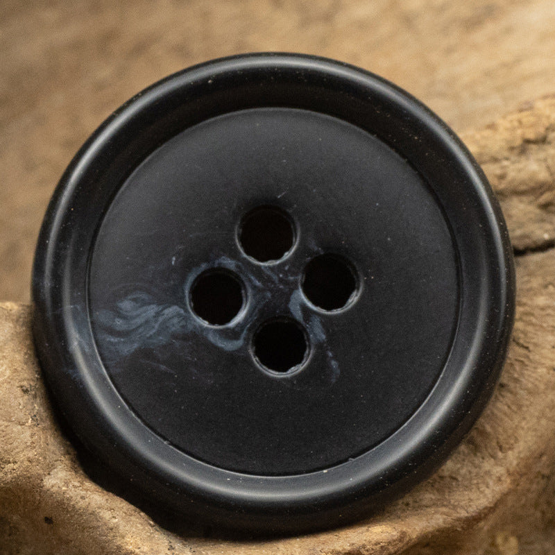 Round 4-hole button in black urea resin