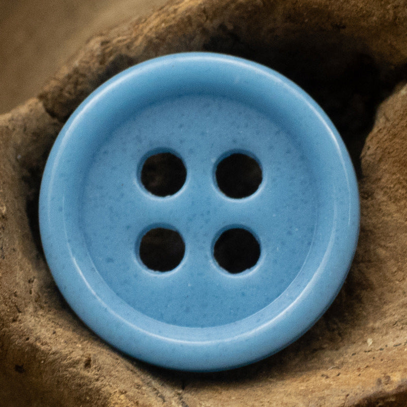 Blue 4-hole round urea resin button