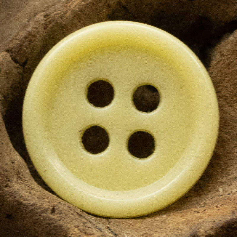 Yellow 4-hole round urea resin button