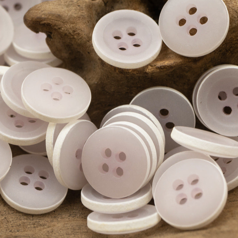 Matte frosted round urea buttons, white, four-hole design