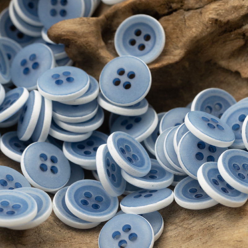 Matte frosted round urea buttons, sky blue, four-hole design