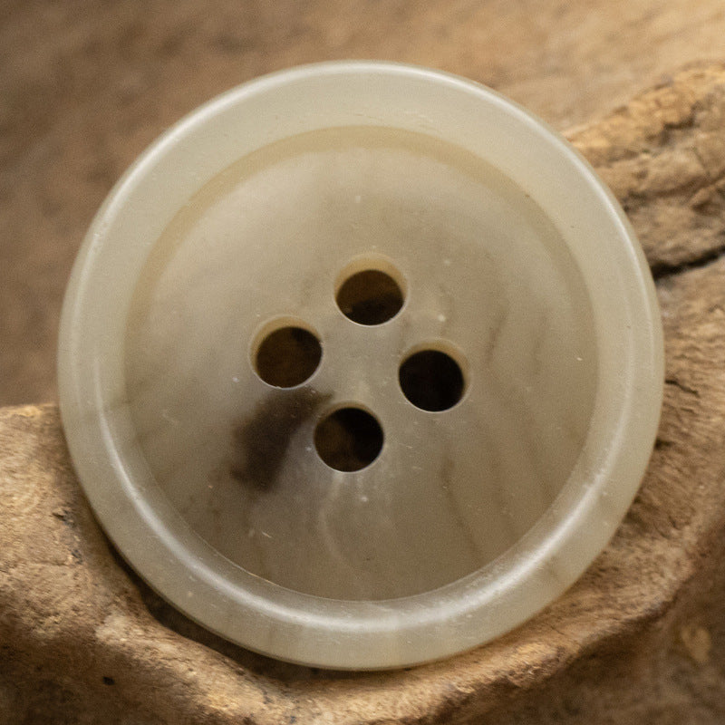 Khaki round four-hole urea button, front view, 15/20mm