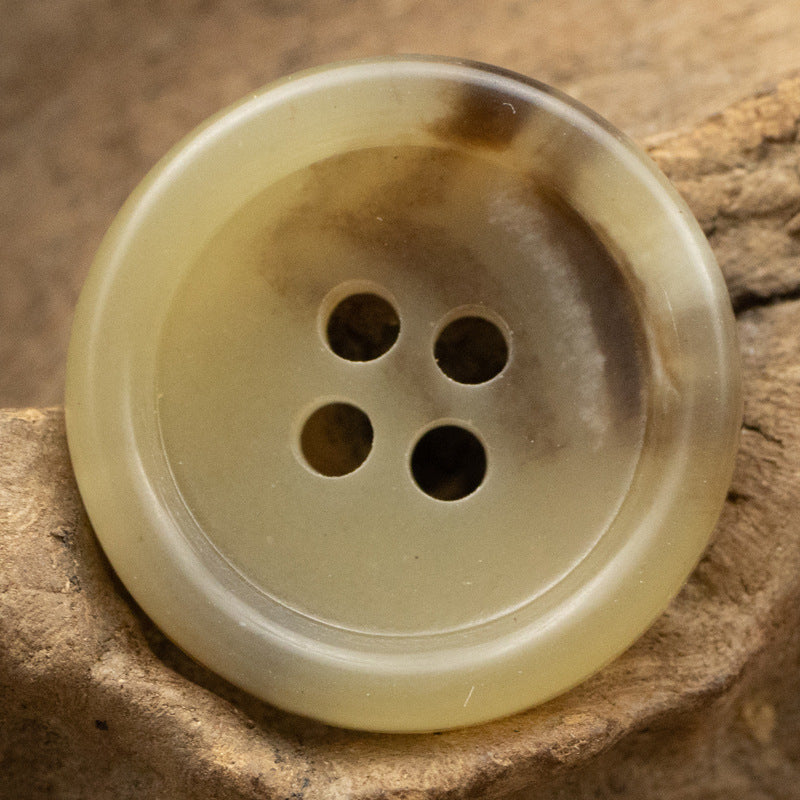 Khaki round four-hole urea button, front view with 4 holes