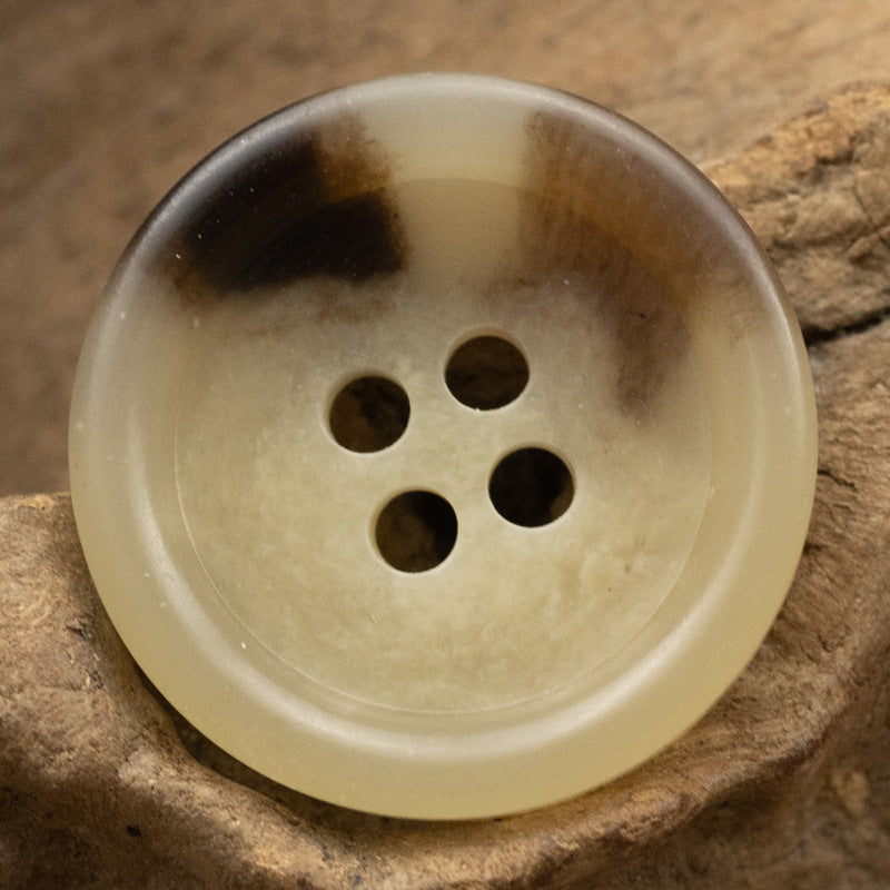 Khaki round four-hole urea button, front view, 15/20mm