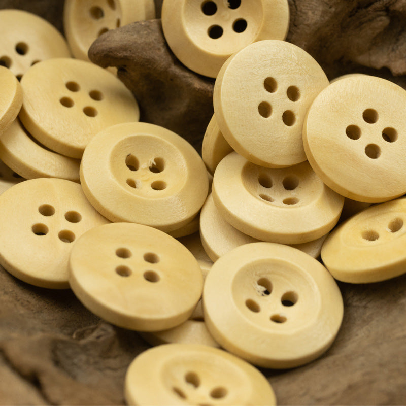 Light cream pear wood buttons, round with four holes