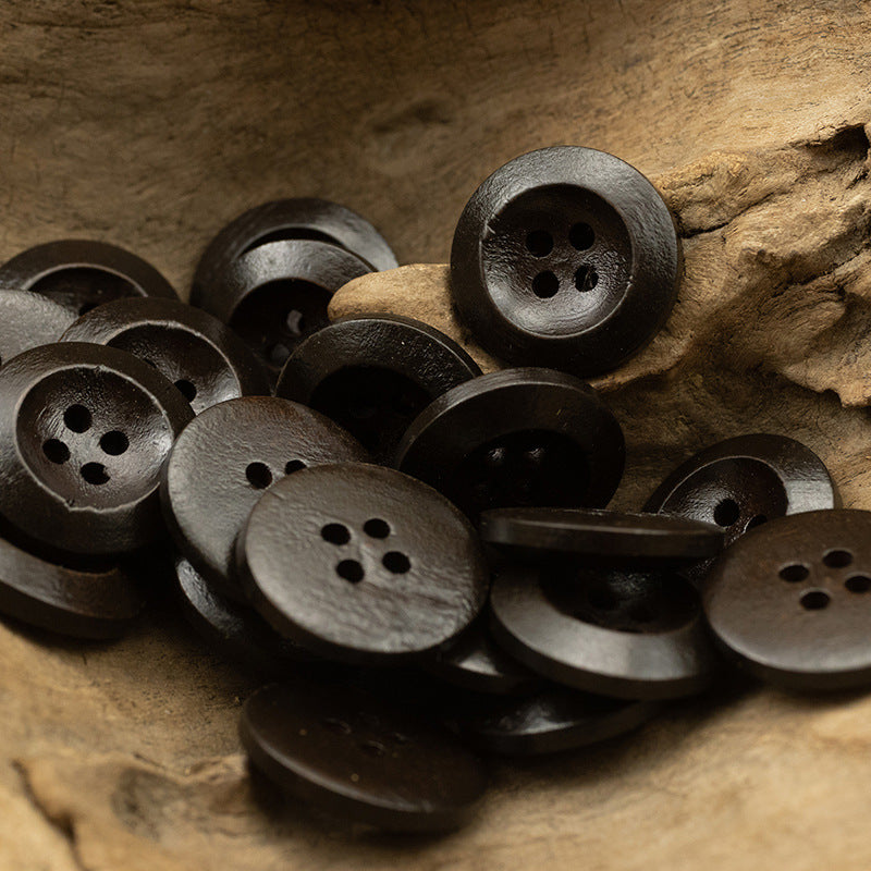 Dark gray/black pear wood buttons, round with four holes