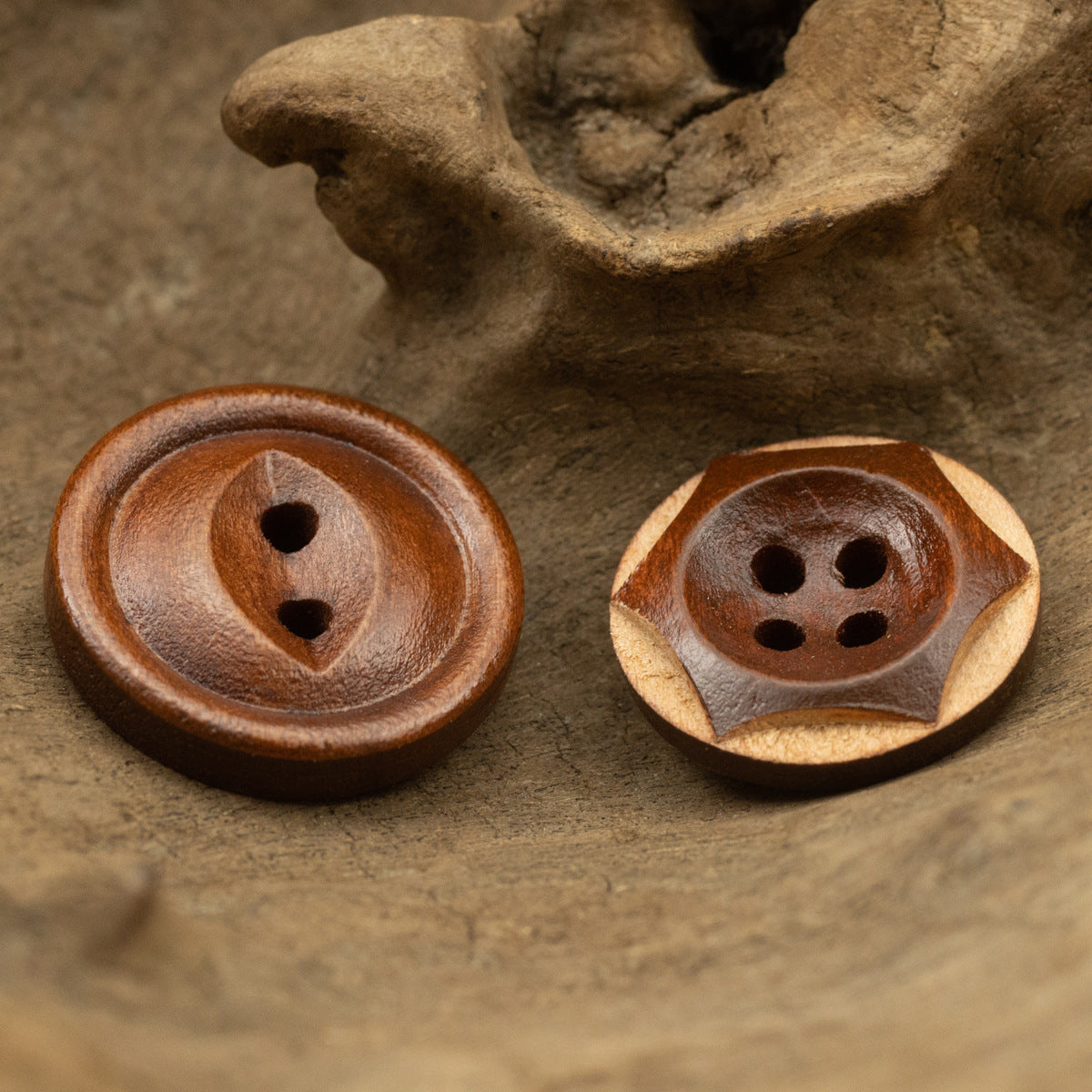 Cat’s Eye wooden buttons in red-brown: one 2-hole, one 4-hole design