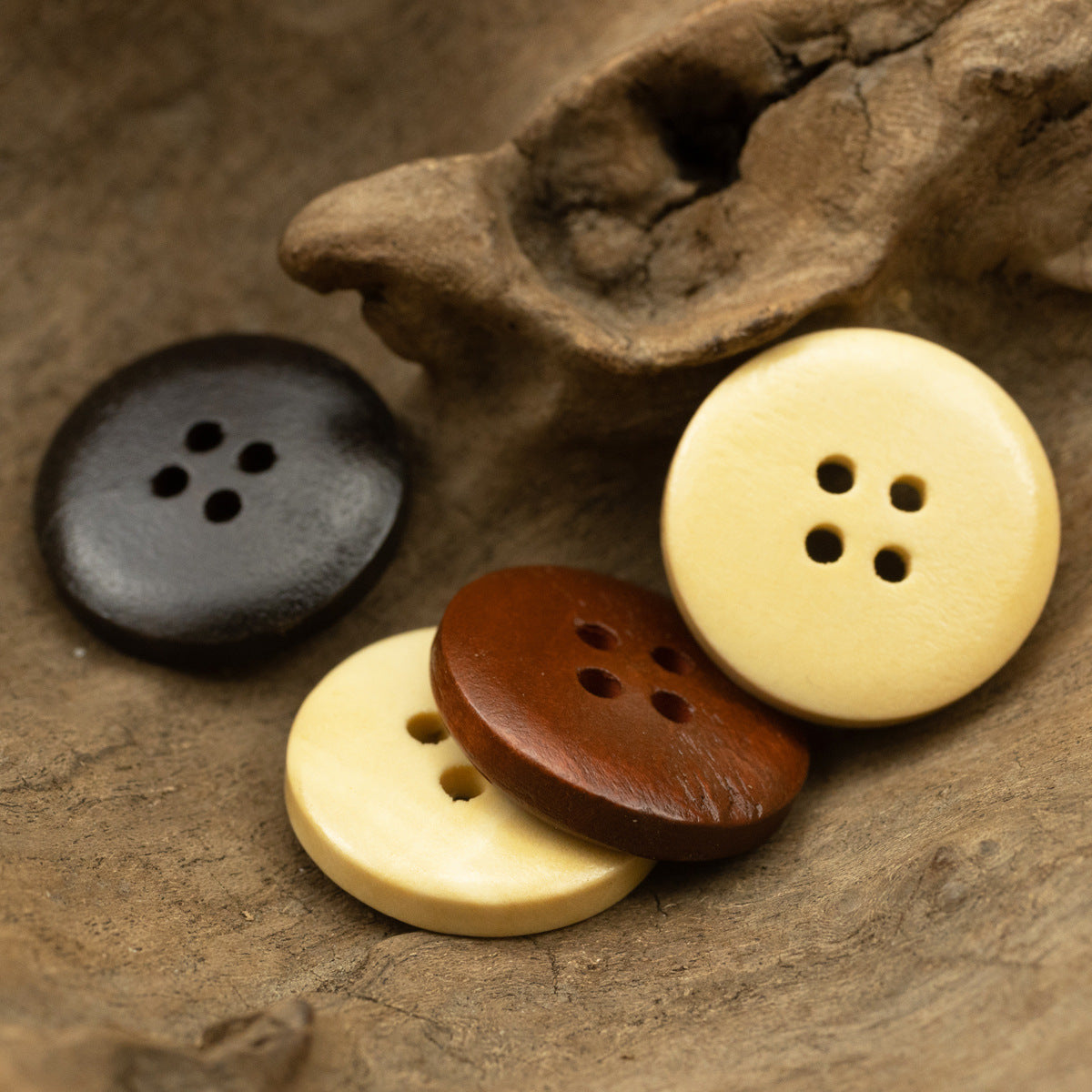 Vintage 4-hole wooden buttons: dark gray, light yellow, and brown (3 shown)