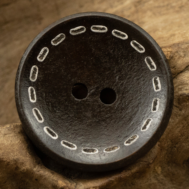 Two-hole dotted wood button, dark wood tone, dotted stitch ring around rim